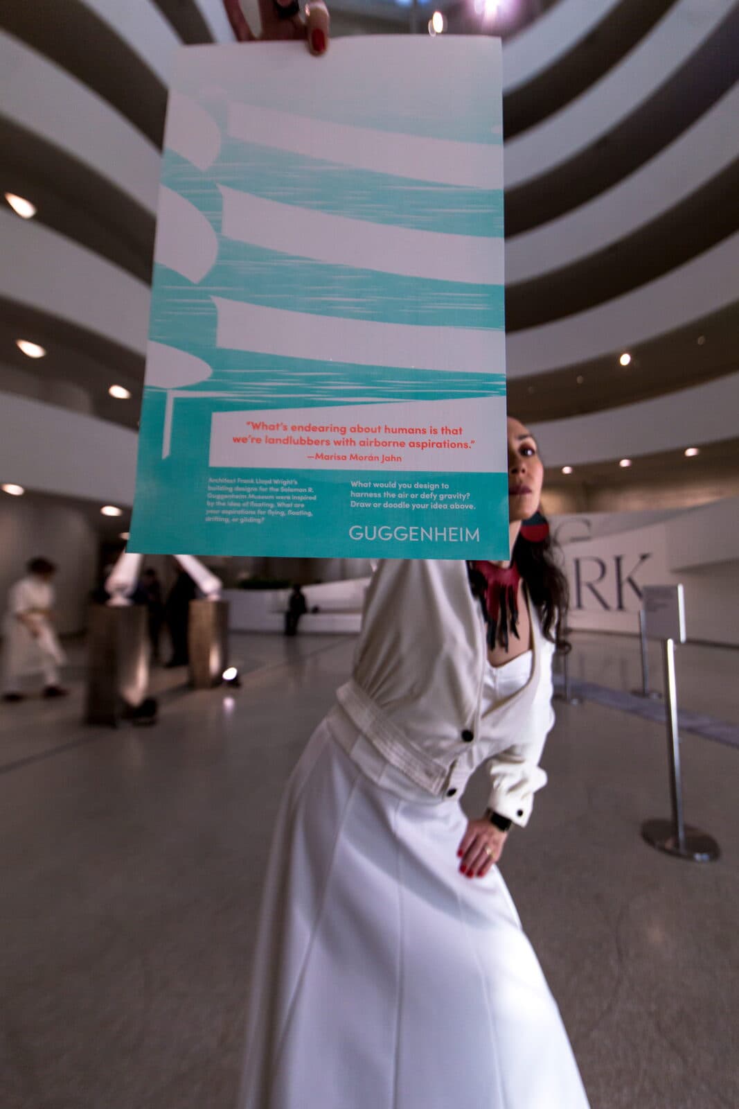 Attendee holding an event program in the rotunda